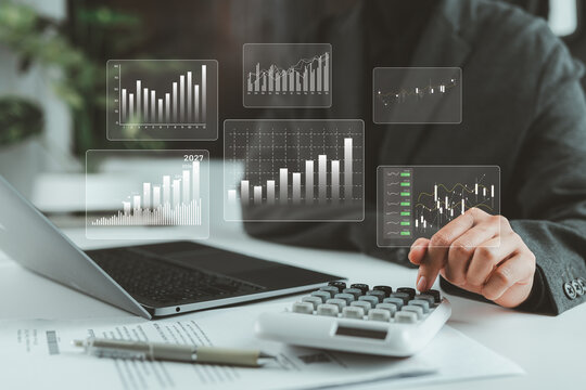 Businesswoman working on finance and accounting reports with calculator and growth chart, representing business financing, banking, investment, and financial management strategy.
