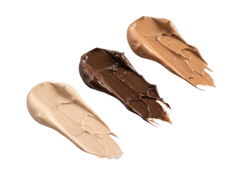 Three distinct shades of liquid foundation makeup smears isolated on transparent background