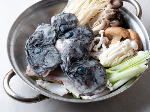 Korean spicy fish stew known as Ureok-maeuntang with raw rockfish chunks and assorted mushrooms