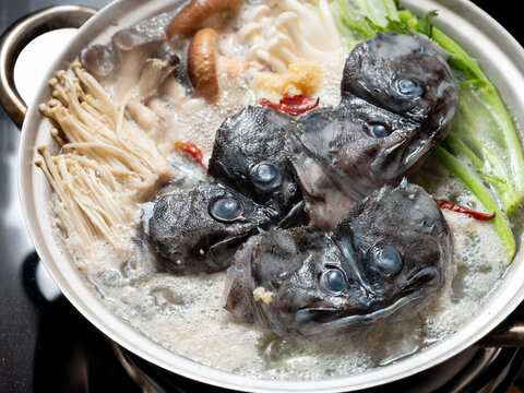 Korean spicy fish stew known as Ureok-maeuntang with raw rockfish chunks and assorted mushrooms