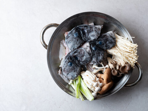 Korean spicy fish stew known as Ureok-maeuntang with raw rockfish chunks and assorted mushrooms