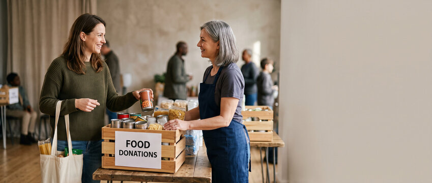 Volunteers sorting food donations at a charity event