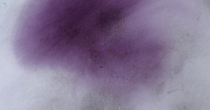 Cinematic abstract background soft purple ink cloud bleeding into white textured paper with fine fibers, dust and grain. Artistic watercolor stain, delicate gradient, space for text, 4K footage