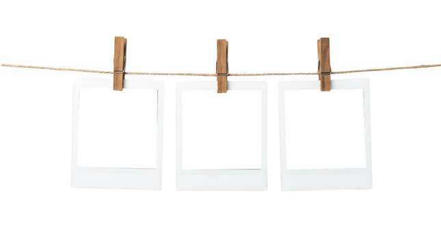 Three polaroid photo frames hanging on a string isolated on transparent background