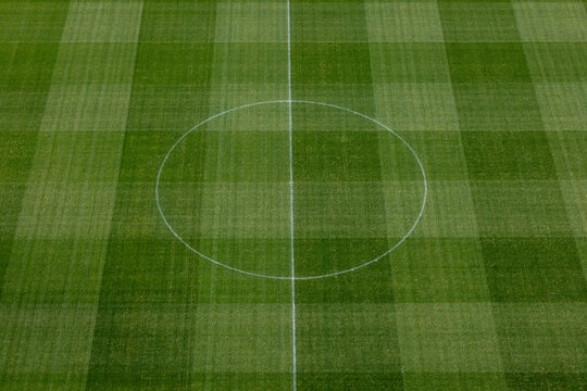 Aerial view of the center circle and checkered grass pattern of the pitch at Darius and Girenas Stadium in Kaunas, Kauno apskritis, Lithuania.