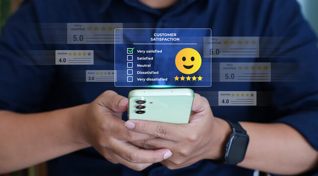 User give rating to service excellent experience with a golden five star rating on mobile phone application. Customer review satisfaction feedback survey concept. 