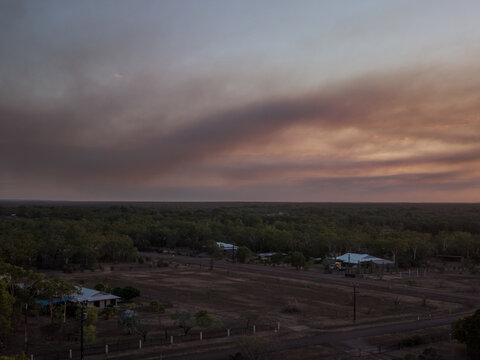 Bushfire smoke in rural sunset sky
