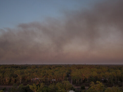 Bushfire smoke in rural sunset sky
