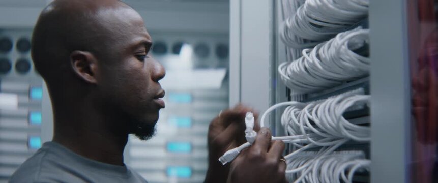 Network Specialist Uses Handheld Analyzer to Certify Installed Data Lines, Evaluating Signal Integrity, Cable Performance and Transmission Parameters During Structured Cabling Quality Assurance.