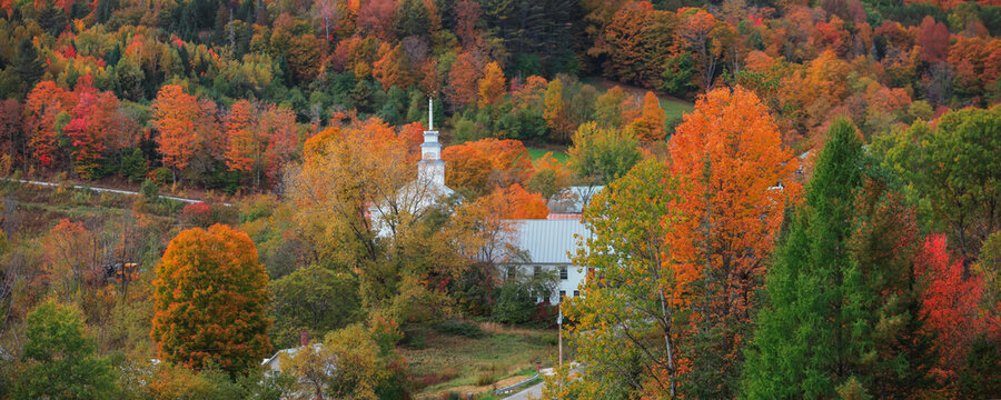 White church amid Vermont fall foliage