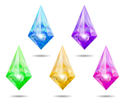Set of five colorful faceted crystal diamond gems isolated on white transparent background