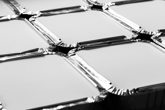 Foil trays takeaway, batch cooking, food containers isolated on a white background backdrop.