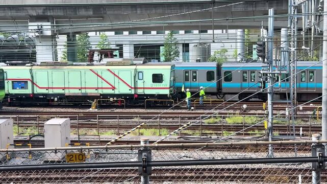 Yamanote Line and Keihin-Tohoku Line Trains Near Tokyo Station