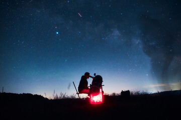 Amateur astronomer observing stars, planets, Moon and other celestial objects with a telescope in nature. © astrosystem