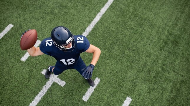 Quarterback throwing a football on a marked turf field from an overhead perspective