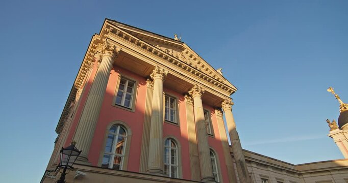 Potsdam City Palace at Alter Markt in Potsdam, Germany, shows a Baroque portal with Corinthian columns in golden-hour light.