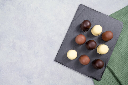 Chocolate teacakes, coated marshmallow treats, krembo, pastry sweets with cookies, fluffy cream and glaze, traditional winter dessert, food selection