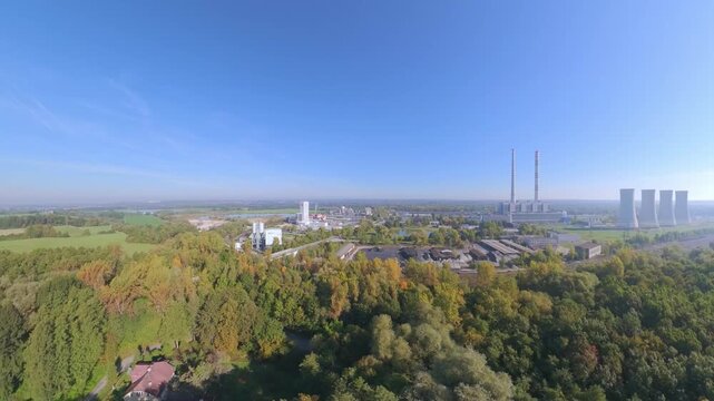 Establishing aerial view of the closed Detmarovice Coal Power Plant amid the Czech industrial forest landscape, suitable for documenting industrial decline, energy transition and post-industrial devel