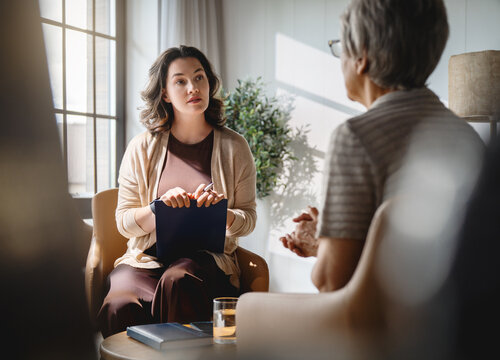 Empathetic Therapist Listening to Senior Patient