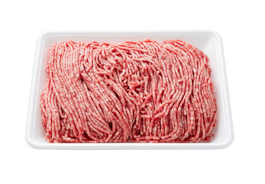 Fresh raw minced meat in a white foam tray isolated on transparent background