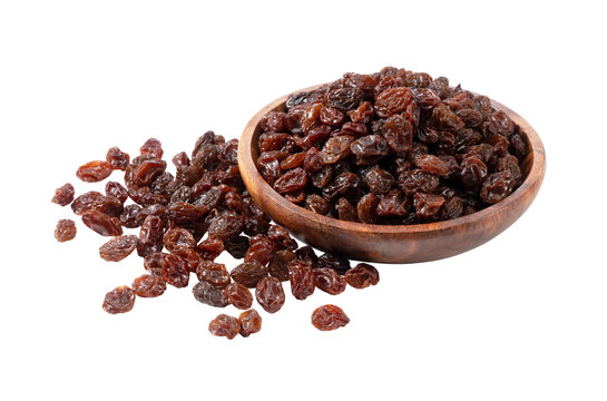 Dried raisins served in a wooden bowl isolated on transparent background