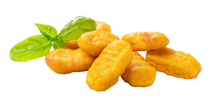 Crispy fried chicken nuggets with fresh basil leaf garnish isolated on transparent background