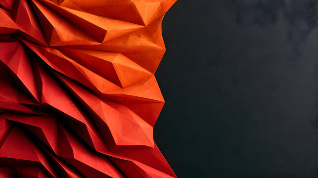 Crimson and orange folded paper beside dark copy space