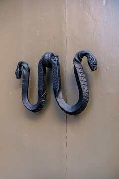 Double Snake Wrought Iron Door Knocker on Taupe Painted Wood