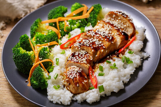 Plate of teriyaki chicken with vegetables and rice