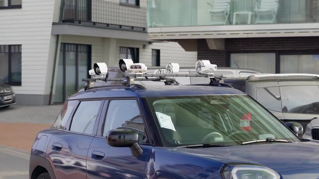 Car Car with roof mounted cameras for automatic detecting parking violations parking enforcement