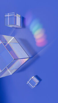 Prism-shaped crystal cubes casting rainbow light on blue background