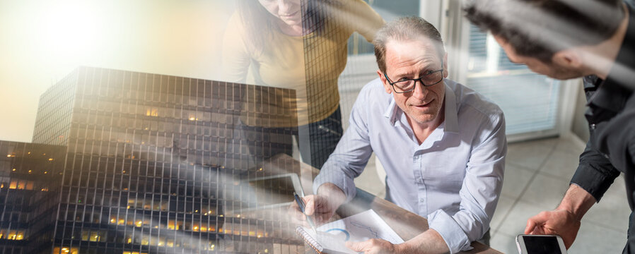 Business people working together; multiple exposure