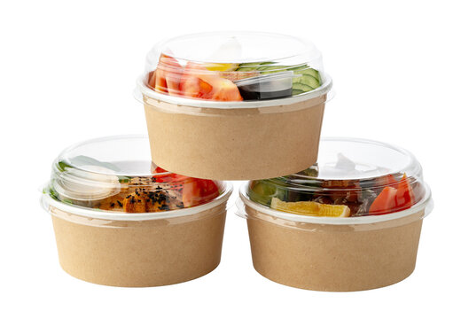 Three takeaway bowls with salads and toppings in compostable paper containers