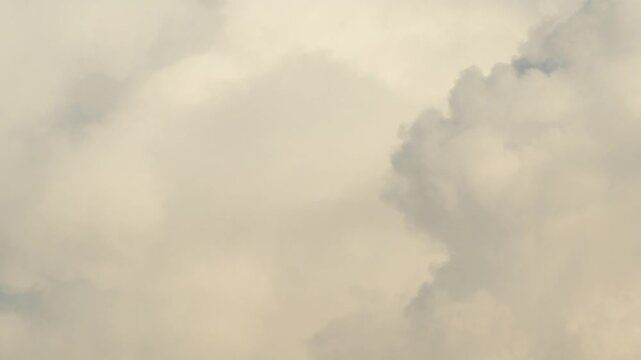 white cumulus cloud against a bright turquoise blue sky dramatic summer minimalist cloudscape background