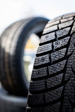 Close Up of Winter Tire Tread with Deep Grooves and Sipes