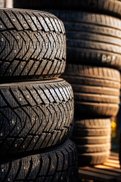 Stacks of Studded Winter Tires Ready for Seasonal Tire Replacement
