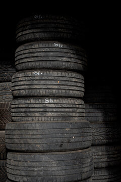 Stack of Used Car Tires with Worn Tread at Tire Storage Facility