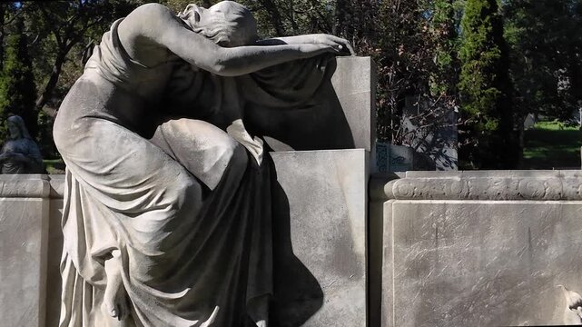 Old Christian Catholic Cemetery &mdash; Dramatic Crying Female Sculpture &mdash; Side Angle MS UHD 4K