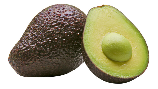 Whole and halved ripe avocado with water droplets on textured dark skin