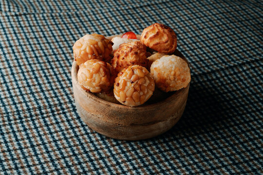 assorted Catalan panellets in a wooden bowl