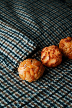 pine nut and coconut panellets on checked fabric