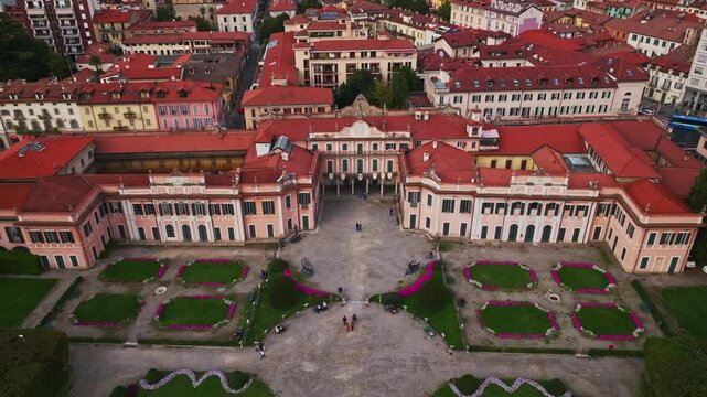 Aerial drone view of Comune di Varese, Palazzo Estense and Giardini Estensi in Varese, Italy, showcasing the historic palace, formal gardens, greenery, and cityscape.