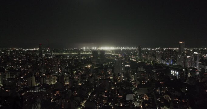 Buenos Aires Argentina Aerial v26 wide night flyover across Palermo city lights toward Aeroparque and the illuminated waterfront horizon - Shot with 5k Camera - Jan 2nd 2026