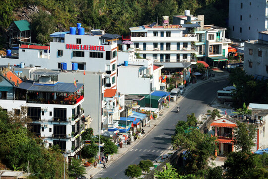 High angle view of hotels and buildings along a mountain road near Ben Beo harbor on Cat Ba Island, Vietnam on January 14, 2026.