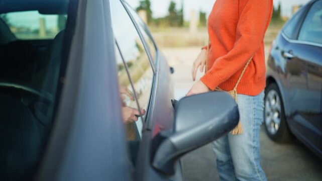 Woman lock parked car with key fob , vehicle security, car theft prevention, personal property protection, responsible driving habits. Everyday automotive safety and independent urban lifestyle