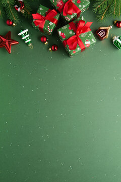 Green Christmas and Happy New Year holiday background with gift boxes, red ribbon bows and festive red ornaments, flat lay with copy space. Greeting card.