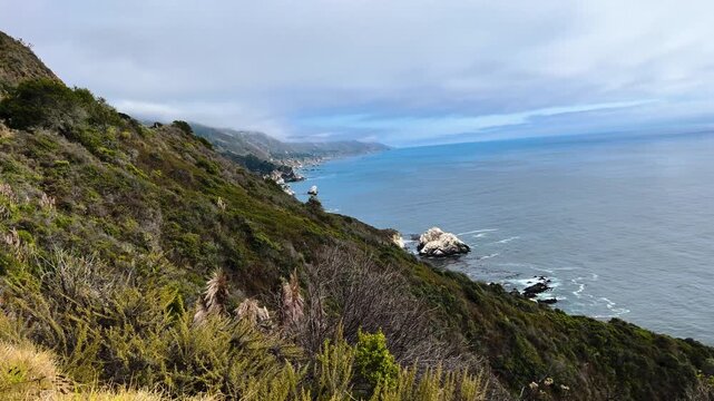 Coastal cliffside overlooking rocky ocean shoreline - Cabrillo Highway, California, United States