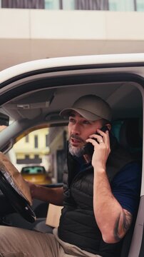 Male courier delivering a package.