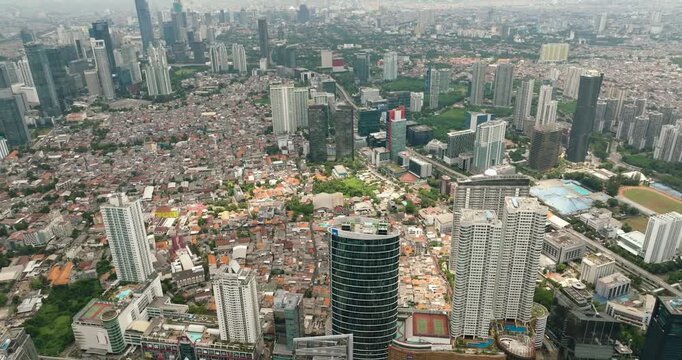 Jakarta business district view from above in Indonesia capital city with many modern skyscrapers. Indonesia.