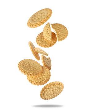 Crispy sandwich cookies falling and breaking isolated on white background